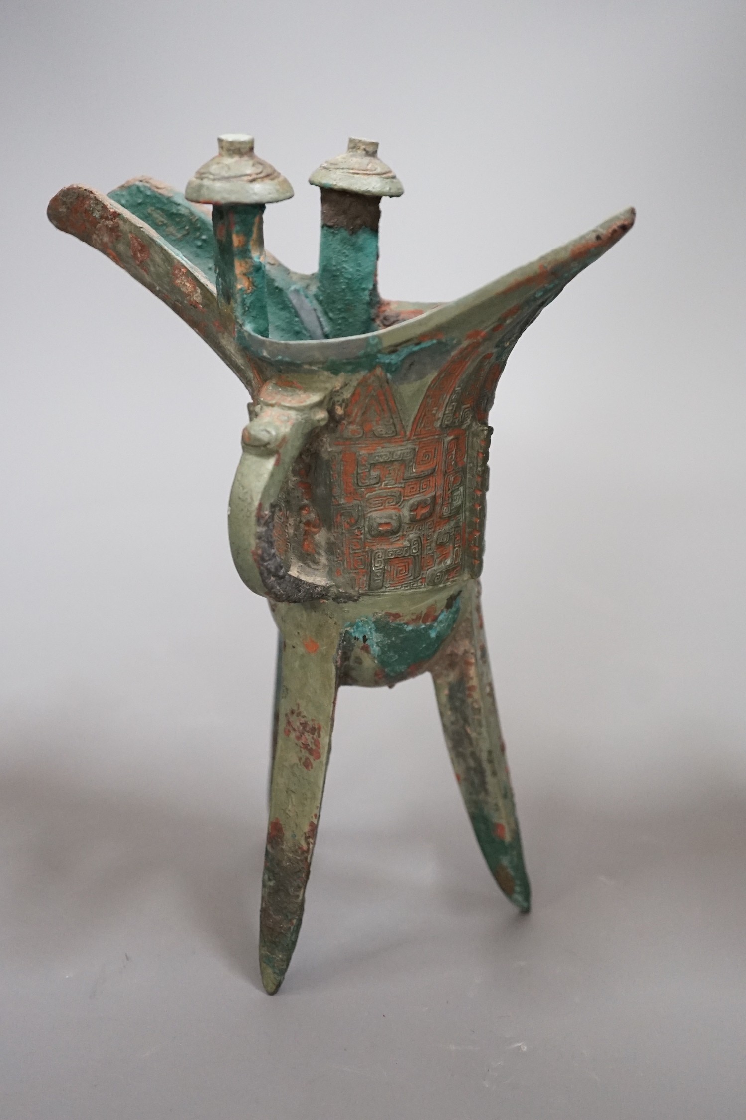 A Chinese archaistic bronze vessel, jue, 21cm high